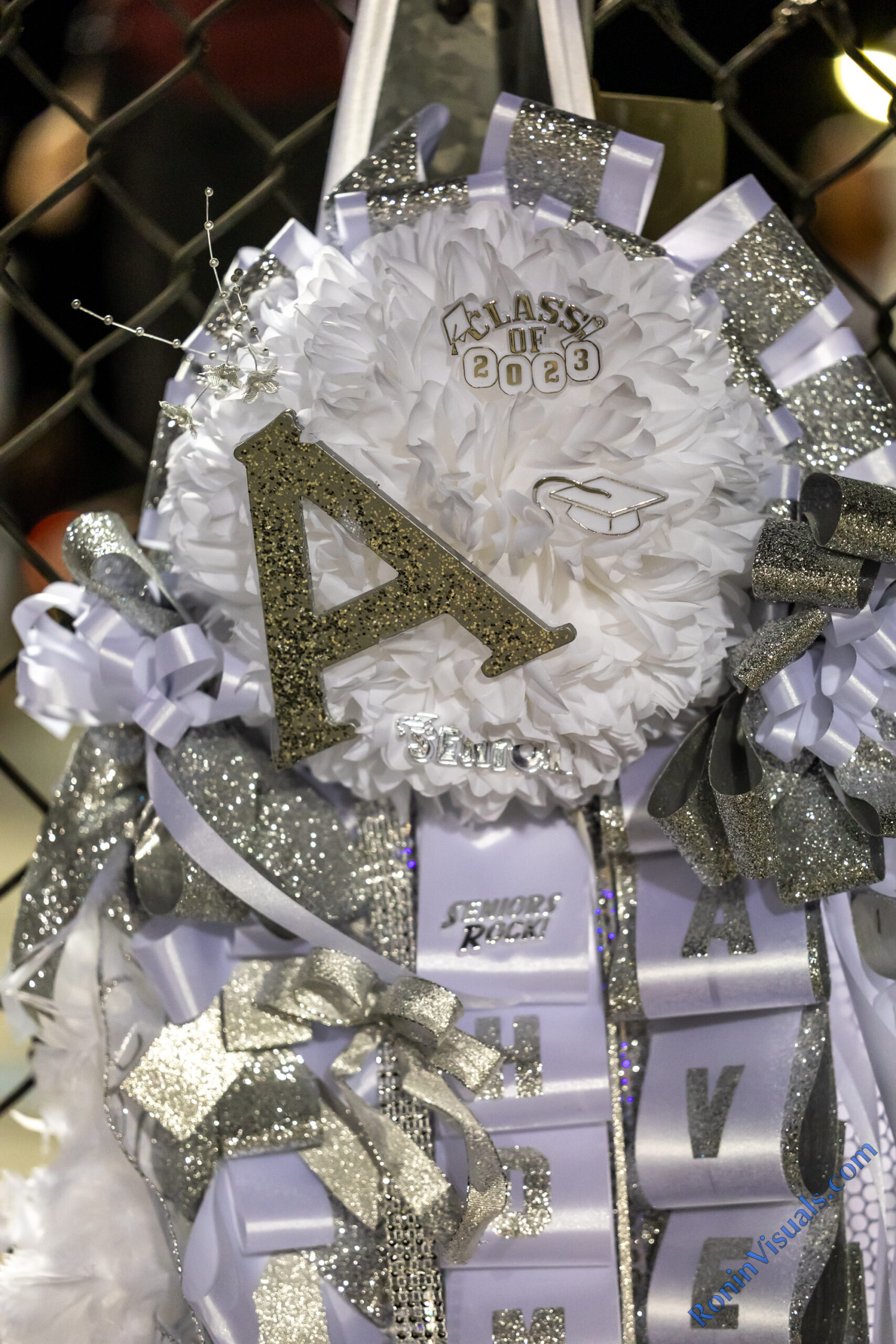 Homecoming mums are about individuality, especially senior year mums! Anything from initials, to personal favorites and extracurricular activities can be incorporated into your mum or garter. (courtesy RoninVisuals.com)